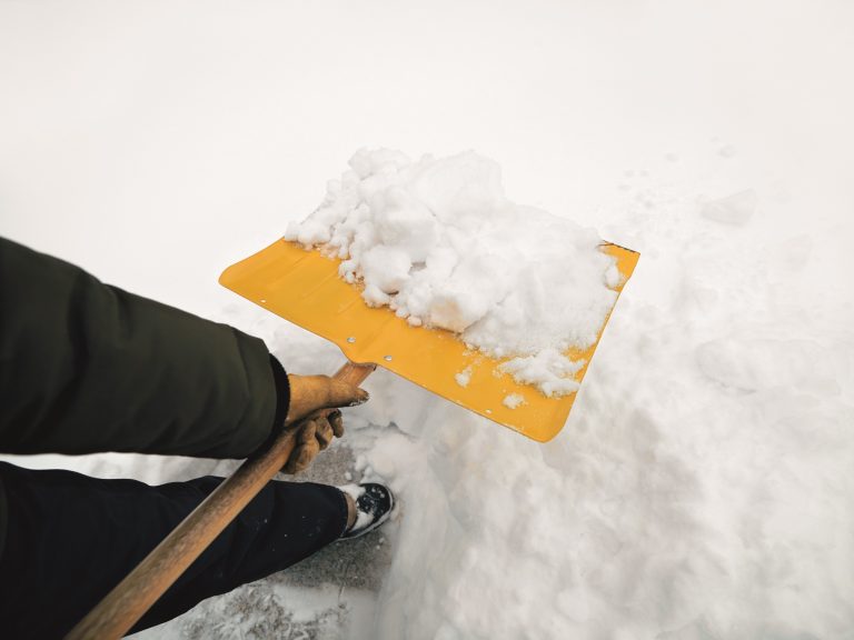 Minnesota, USA --- Shoveling Snow --- Image by © Ron Chapple/Corbis